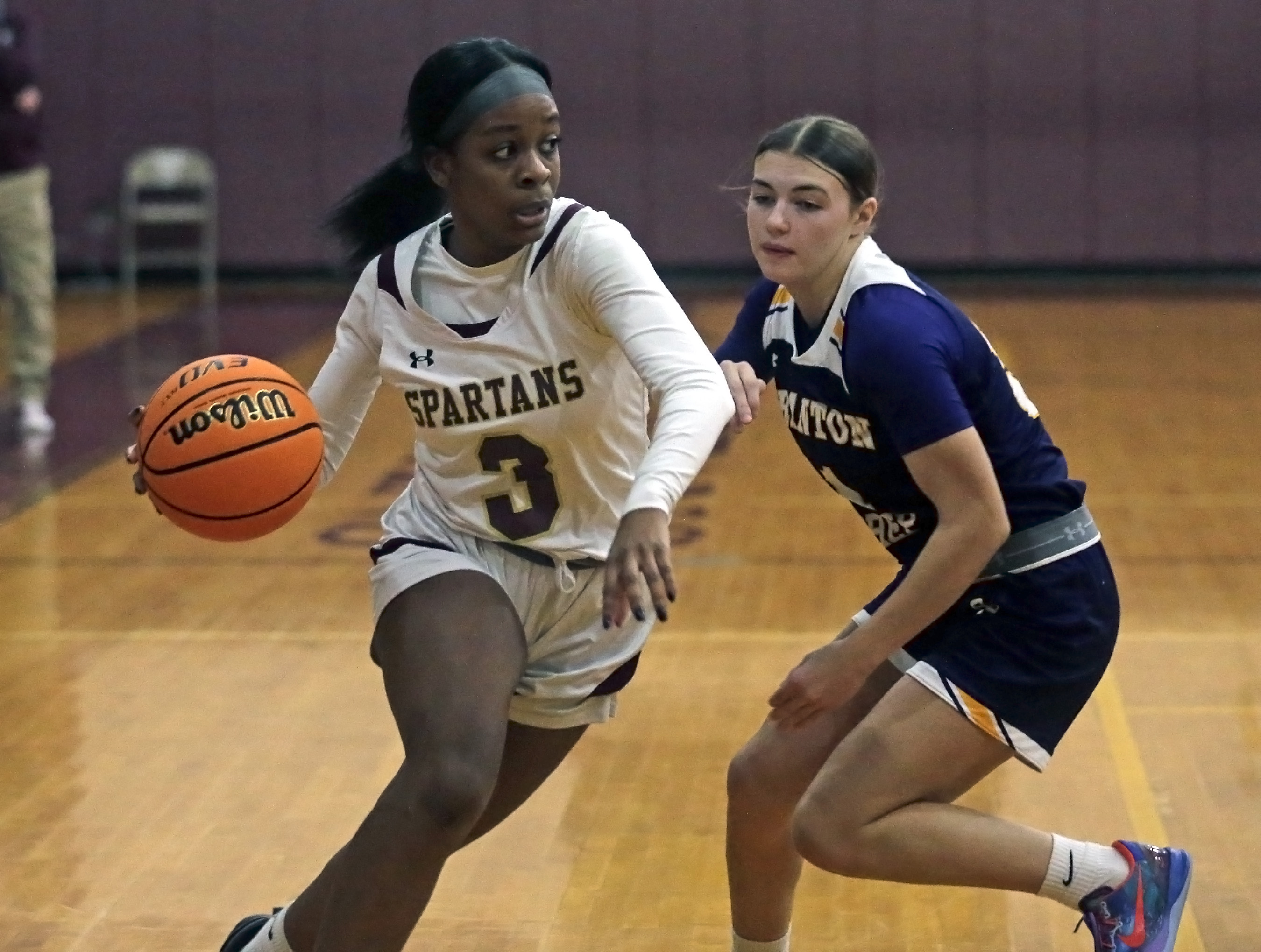 Wyoming Valley West’s Ava Yancey, left, drives the baseline against...
