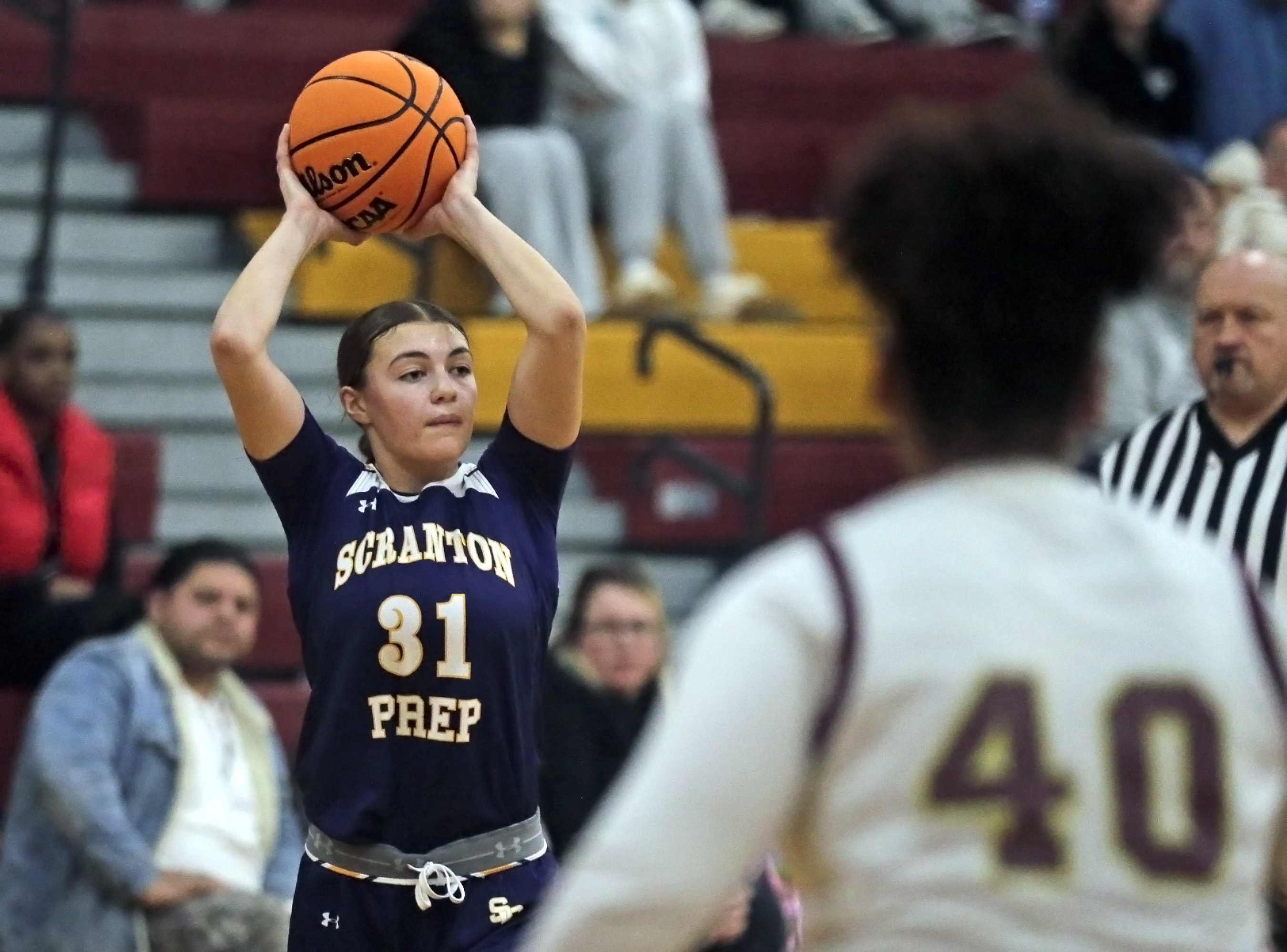Scranton Prep’s Eva Kaszuba (31) looks to pass against Wyoming...