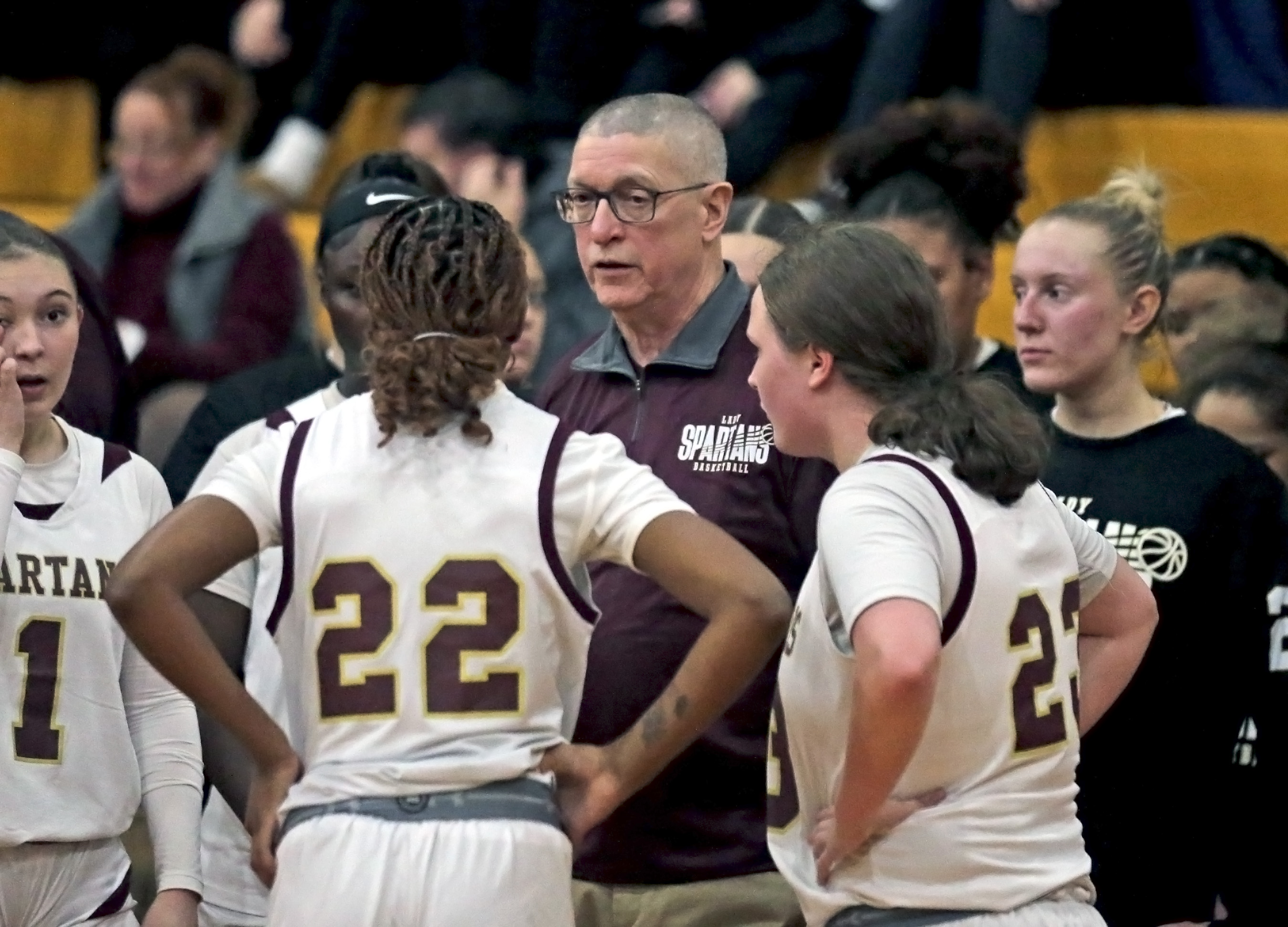 Wyoming Valley West head girls basketball coach Gary Ferenchick, center,...