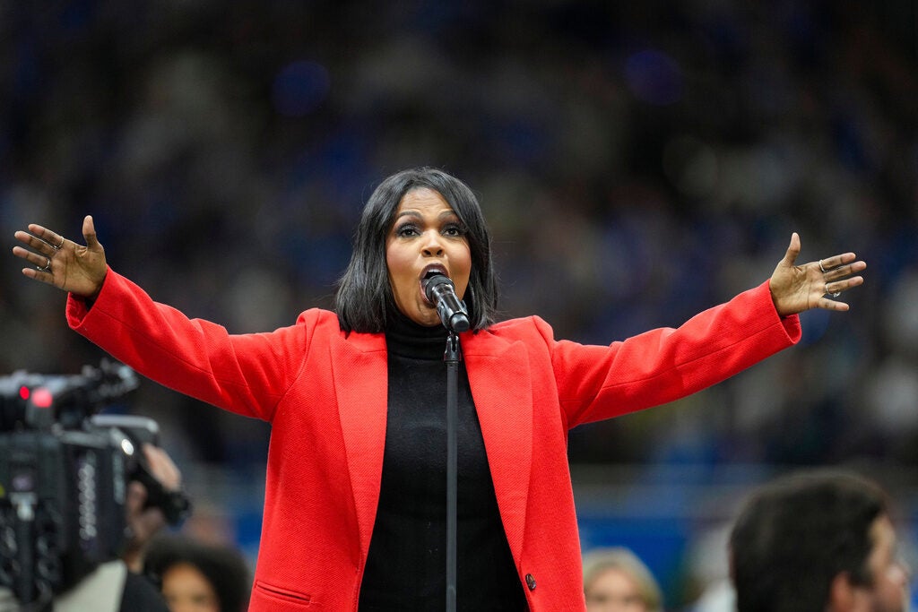 Singer CeCe Winans performs the National Anthem before an NFL football game