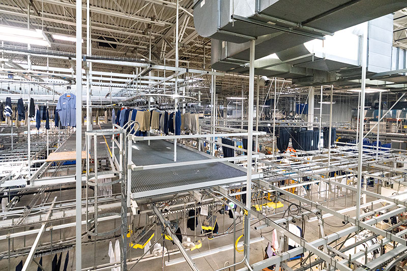 Automated garment systems inside Dempsey Uniform & Linen Supply’s Jessup, PA, plant process rental uniforms and linens.