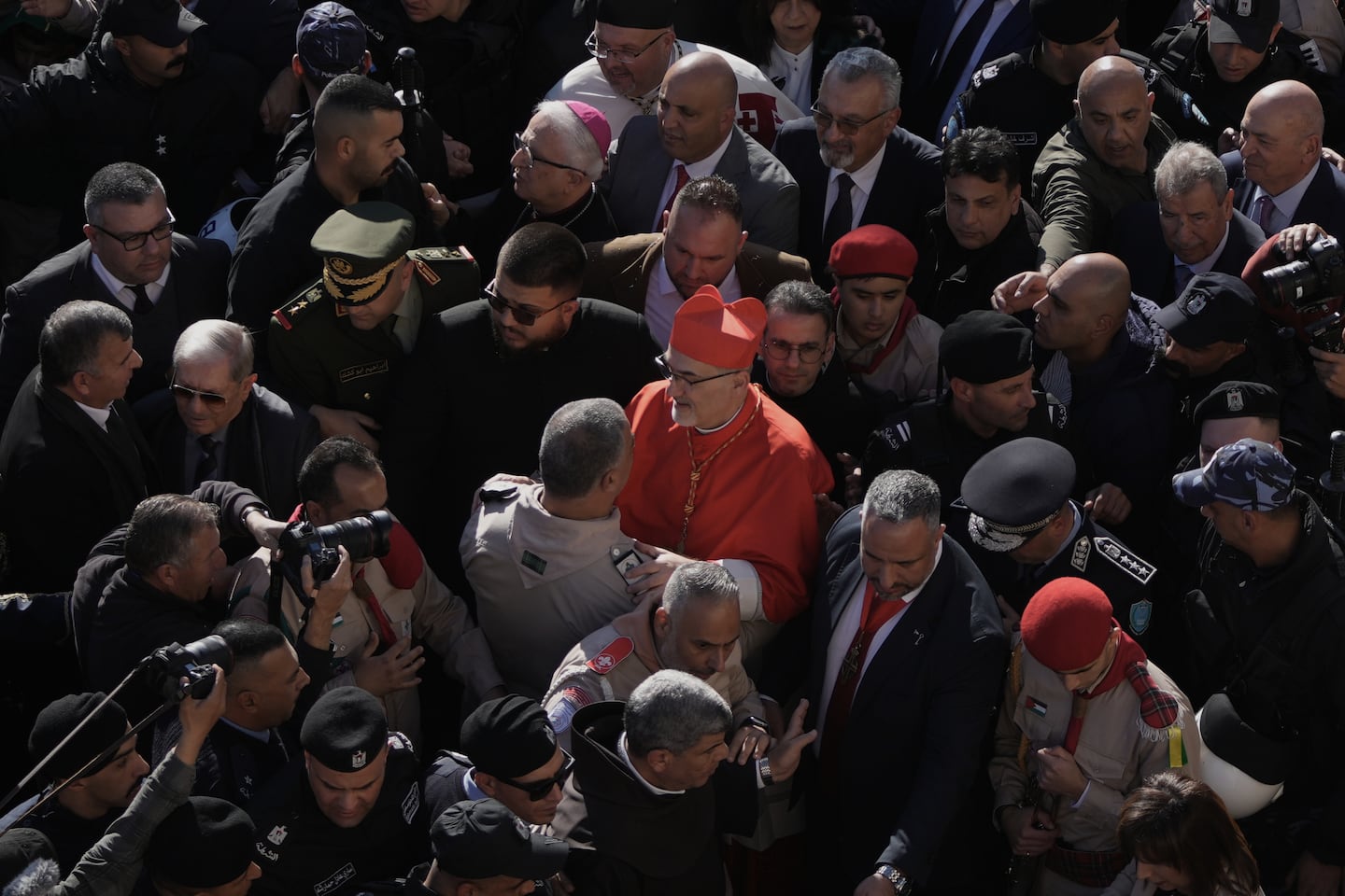 Latin Patriarch Pierbattista Pizzaballa, the top Catholic clergyman in the Holy Land, center, arrives at the Church of the Nativity, traditionally believed to be the birthplace of Jesus, on Christmas Eve, in the West Bank city of Bethlehem.