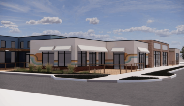 A rendering shows the proposed design of a new commercial development in downtown Erie.