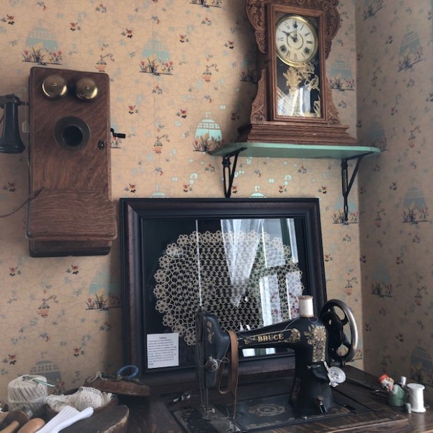 The sewing machine from the early 1900s in the Wise Homestead Museum in Erie was used by Elizabeth Wise Kissell's grandmother. The wall telephone was gifted to the museum. (Ed Otte/For the Greeley Tribune)