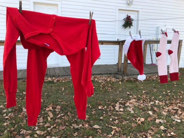 Santa's red long johns, cap and socks hang on a clothesline in the backyard of the Wise History Museum in Erie. (Ed Otte/For the Greeley Tribune)