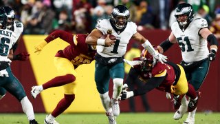 LANDOVER, MARYLAND – DECEMBER 20: Jalen Hurts #1 of the Philadelphia Eagles runs with the ball during the second quarter of an NFL football game against the Washington Commanders at Northwest Stadium on December 20, 2025 in Landover, Maryland. (Photo by Kevin Sabitus/Getty Images)