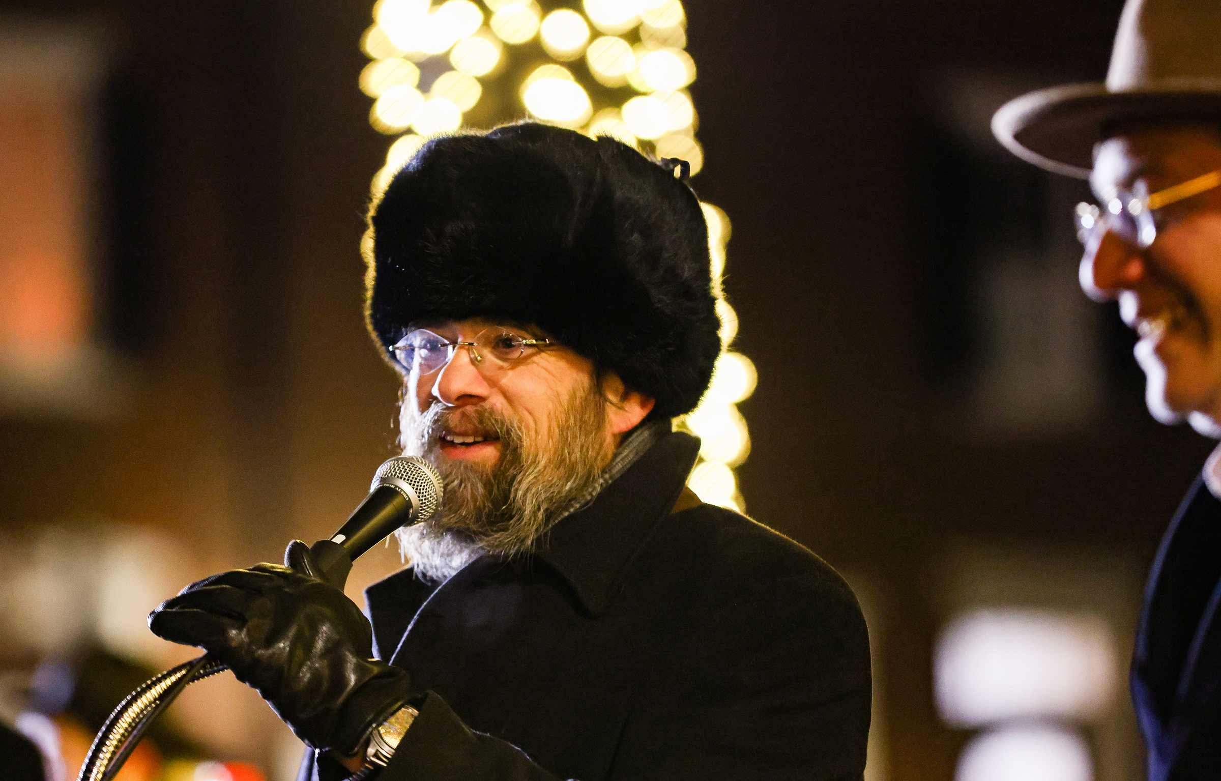 Rabbi Yaakov Halperin talks to the crowd before he lights the menorah.  Chabad Lubavitch of the Lehigh Valley celebrates Hanukkah with a "Lighting of Unity" public menorah lighting Monday, Dec. 15, 2025, on Payrow Plaza outside Bethlehem City Hall.