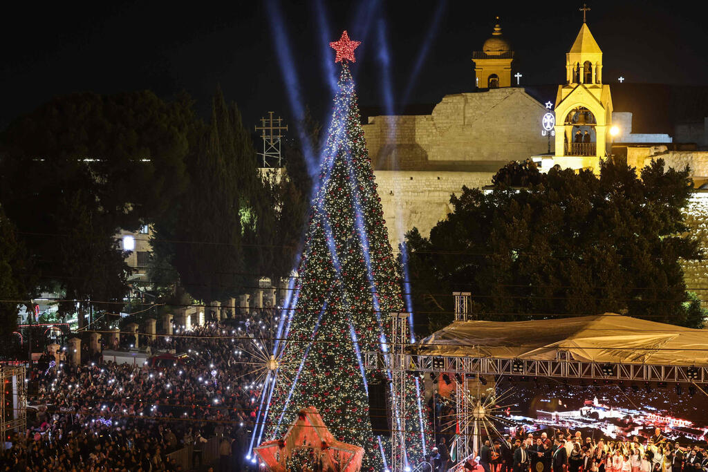 Spectators gather on Nativity Square during a Christmas tree lighting ceremony in Bethlehem, West Bank, on December 6, 2025 