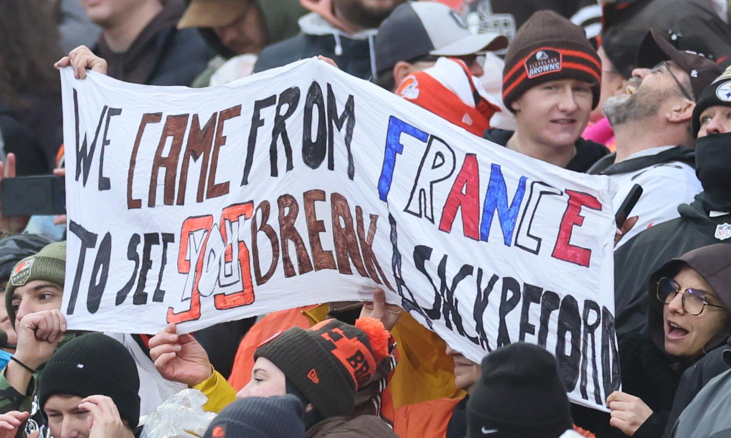 Cleveland Browns’ fans hold up signs hoping to witness Cleveland Browns defensive end Myles Garrett breaking the NFL record for sacks in a season.  