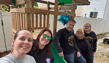 The Discovery FCU team builds a playset for a local child fighting cancer