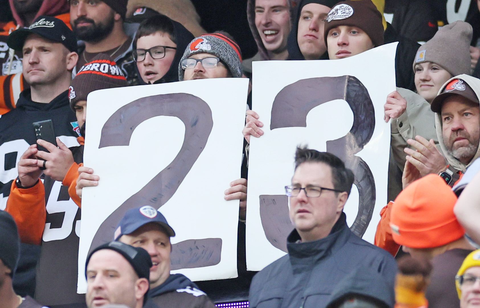 Cleveland Browns’ fans hold up signs hoping to witness Cleveland Browns defensive end Myles Garrett breaking the NFL record for sacks in a season.  