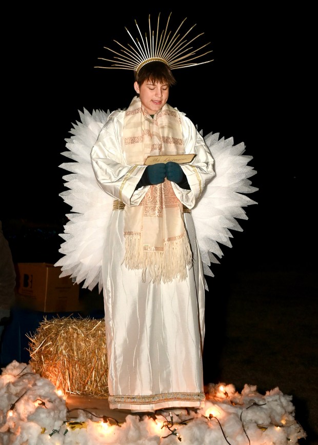 Maggie Krall, 17, portrays an angel in Moving Communities To Christ church's live Nativity performance at Christmas in Birdsboro at Main Bird Park on Dec. 13. (Jesi Yost/For MediaNews Group)