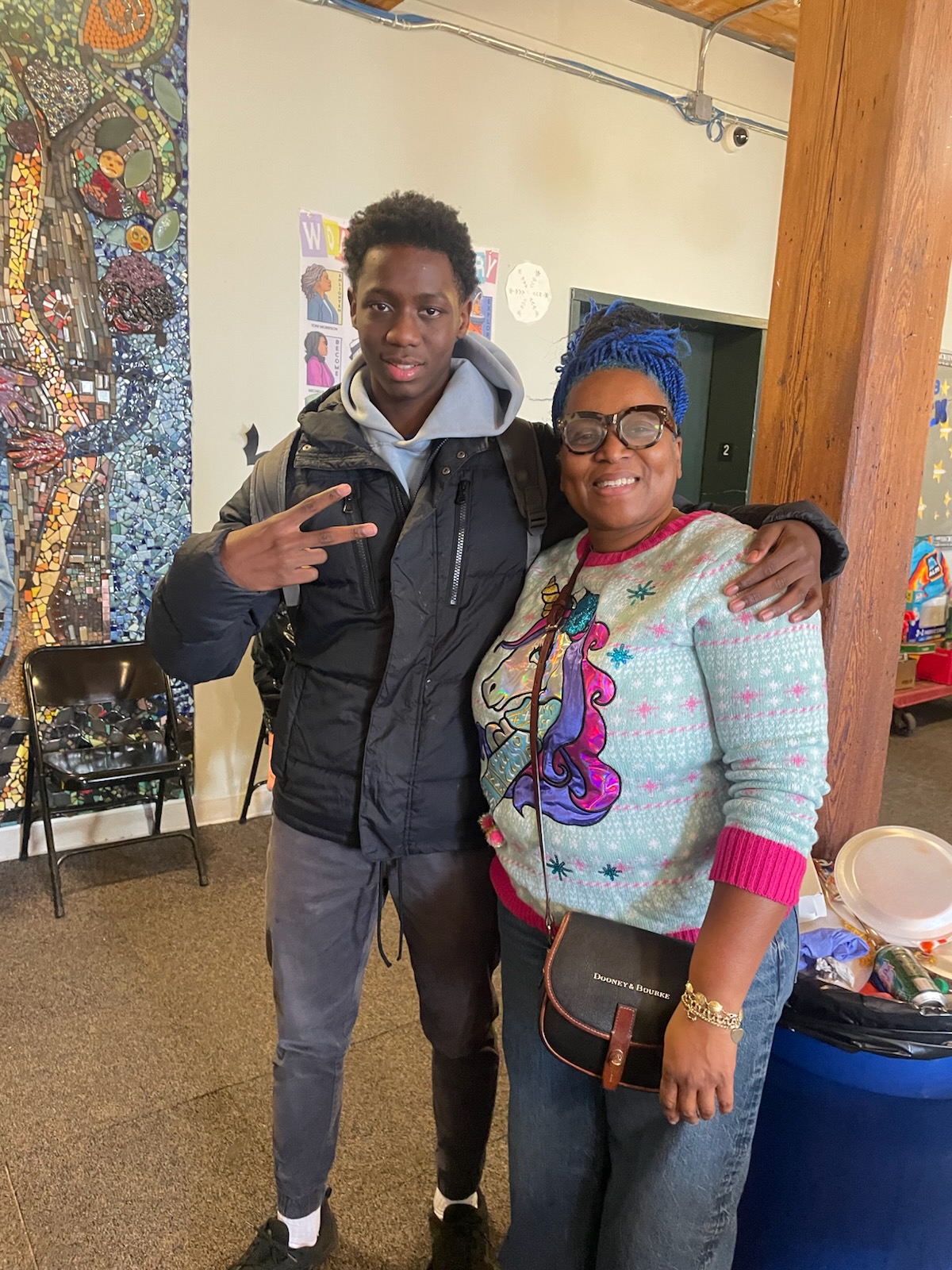 CB Community Schools student Malachi chats with Nyree Ellison, CB...