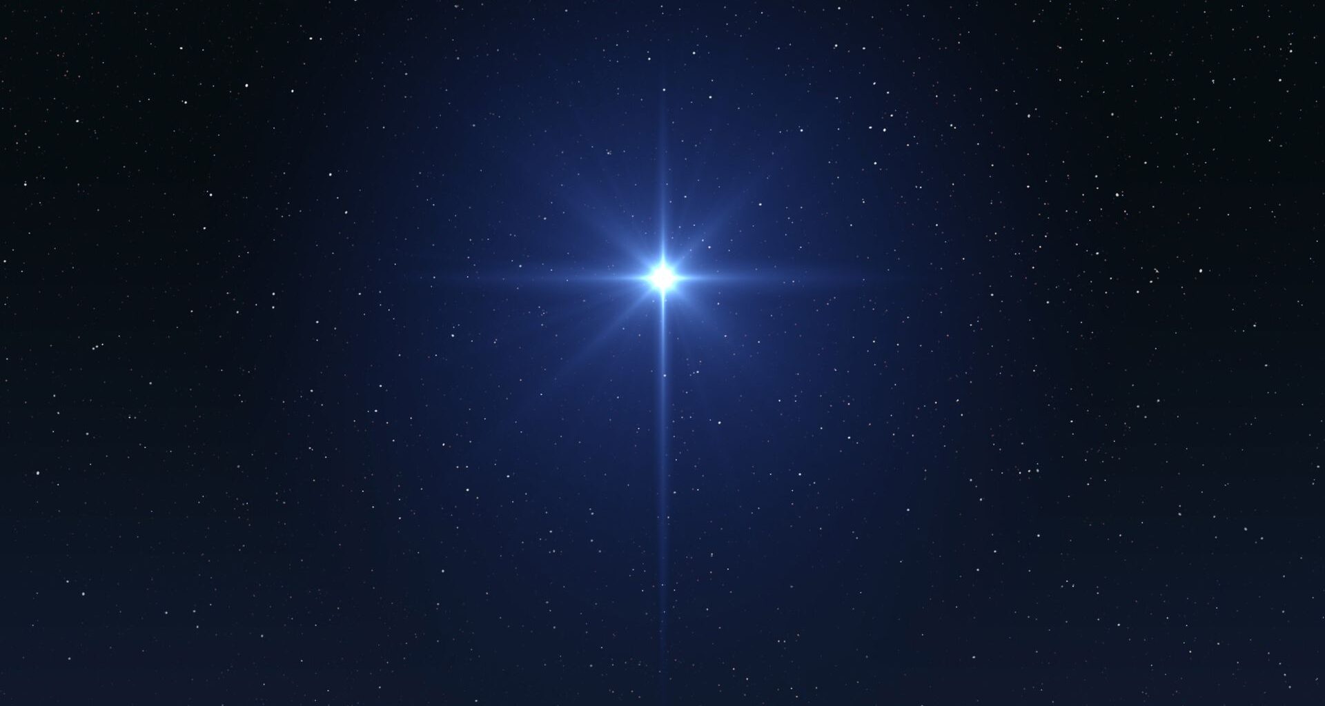 A bright star twinkles in a deep blue night sky