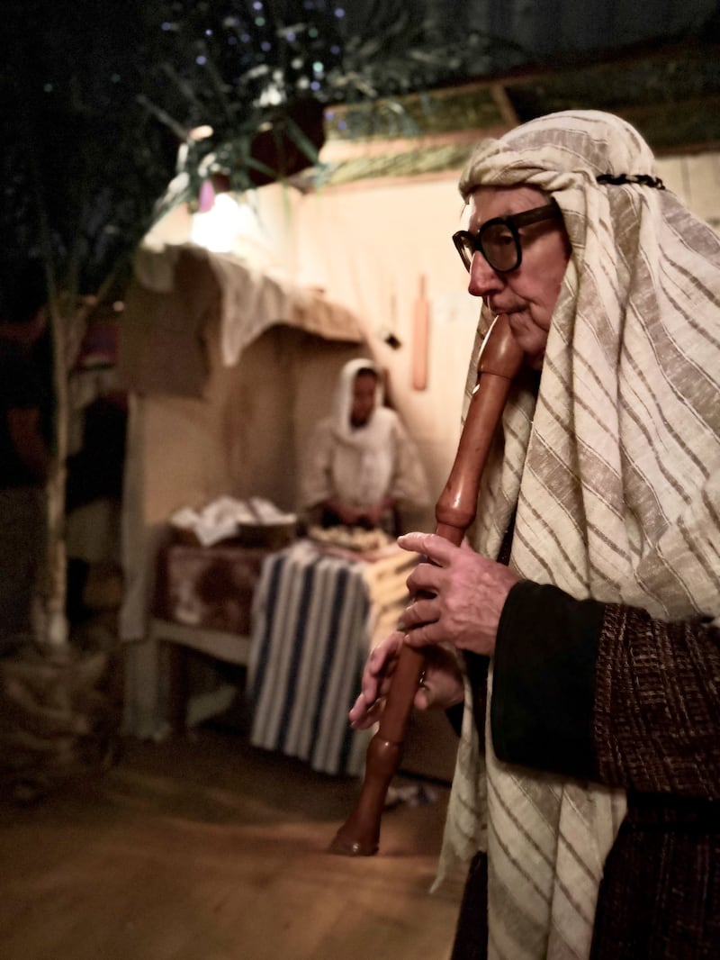 A volunteer plays a wooden flute in the Bethlehem Walk of Escondido, which ran Dec. 12-14, 2025, at the Escondido California Stake Center.