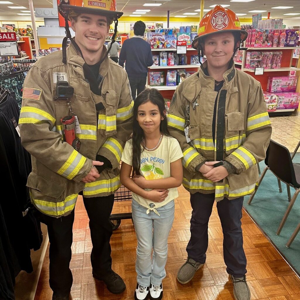 Exeter firefighters help students shop for the holidays