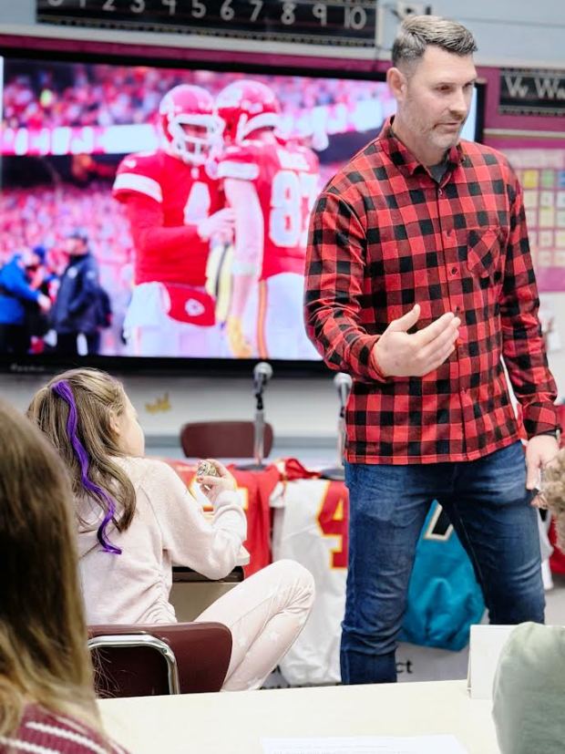 Former NFL quarterback and Wilson High School alum Chad Henne recently visited a Green Valley Elementary School classroom. Students staged a press conference, asking Henne questions about his football career. (Courtesy of Alvernia University's Total Experience Learning Institute)