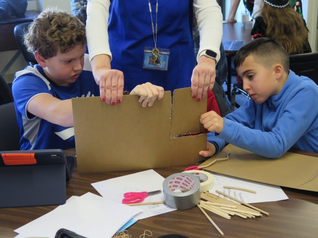 Oley Valley Elementary School fourth grader Grant Scober, left, and third grader Leo Sottosanti work on their project during the inaugural Keystone STEM Competition at the Berks County Intermediate Unit on Tuesday. (DAVID MEKEEL - READING EAGLE)