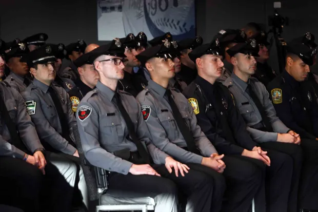 Members of the Reading Police Academy's second graduating class of 2025 await their diplomas at the Redner's Event Center in FirstEnergy Stadium on Monday, Dec. 22, 2025. (BILL UHRICH/READING EAGLE)
