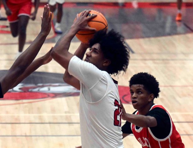 Reading High's Weshly Rosario goes for two of his game-high 18 points in a 52-44 Bulldog victory over the Red Knights on Firday, Dec. 19, 2025, at the Geigle. (BILL UHRICH/READING EAGLE)