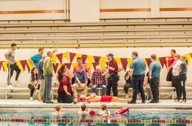 Coaches and athletic trainers from Berks County schools participated in a pool rescue event featuring several scenarios, including a cardiac arrest, a head and spine injury, and a panic attack. (Submitted photo)