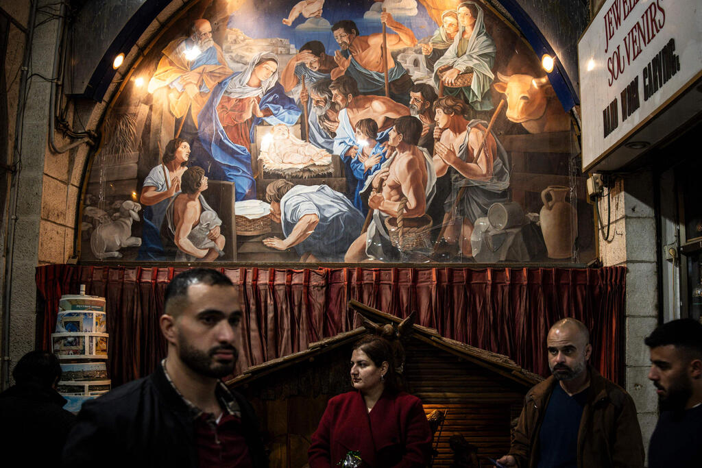 People gather in Nativity Square during a Christmas tree lighting ceremony in Bethlehem, West Bank, on December 6, 2025 