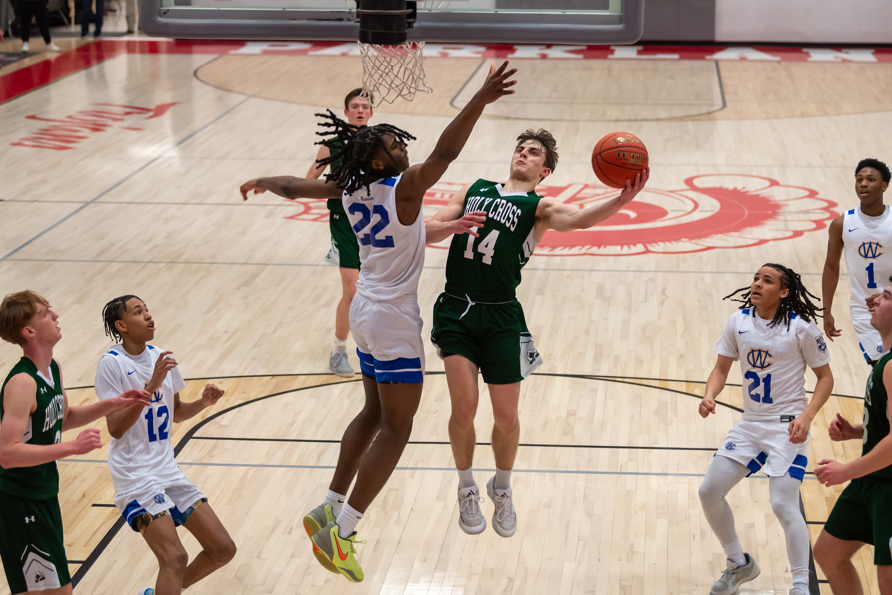 West Catholic junior Kingston Wheatly (22) tries to block Holy...