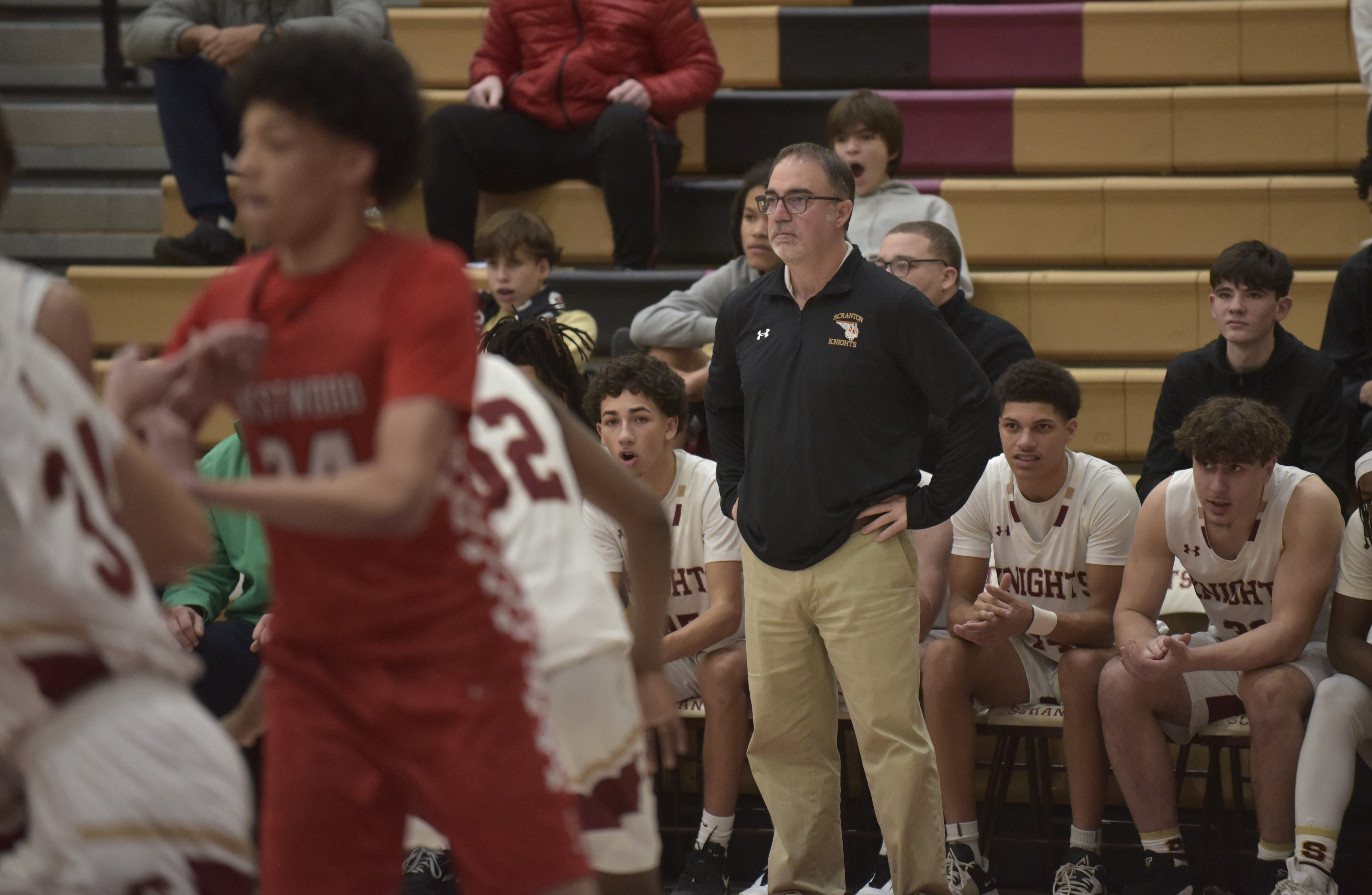 Scranton High School boys basketball coach Tony Battaglia patrols the...