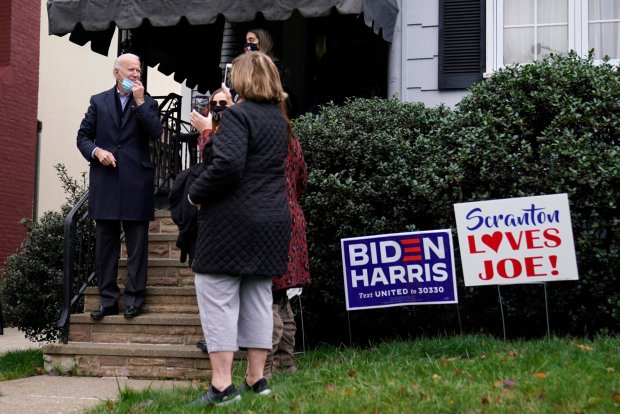 Then-Democratic presidential candidate Joe Biden greets supporters Nov. 3, Election Day, as he leaves his boyhood home in Scranton's Green Ridge section.