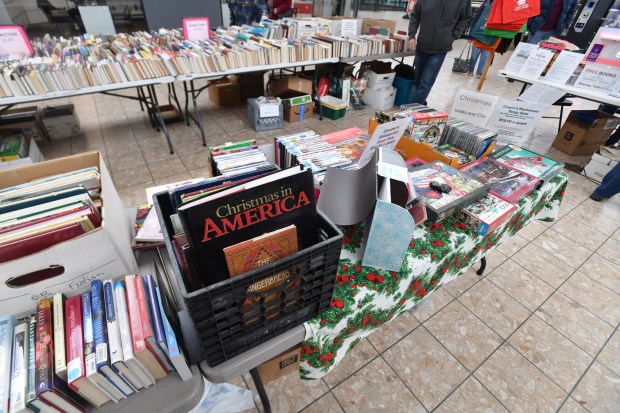 Many different categories of books are for sale during the The Friends of the Scranton Public Library Book Sale on the upper level at The Marketplace at Steamtown in Scranton Thursday, December 4, 2025. (SEAN MCKEAG / STAFF PHOTOGRAPHER)
