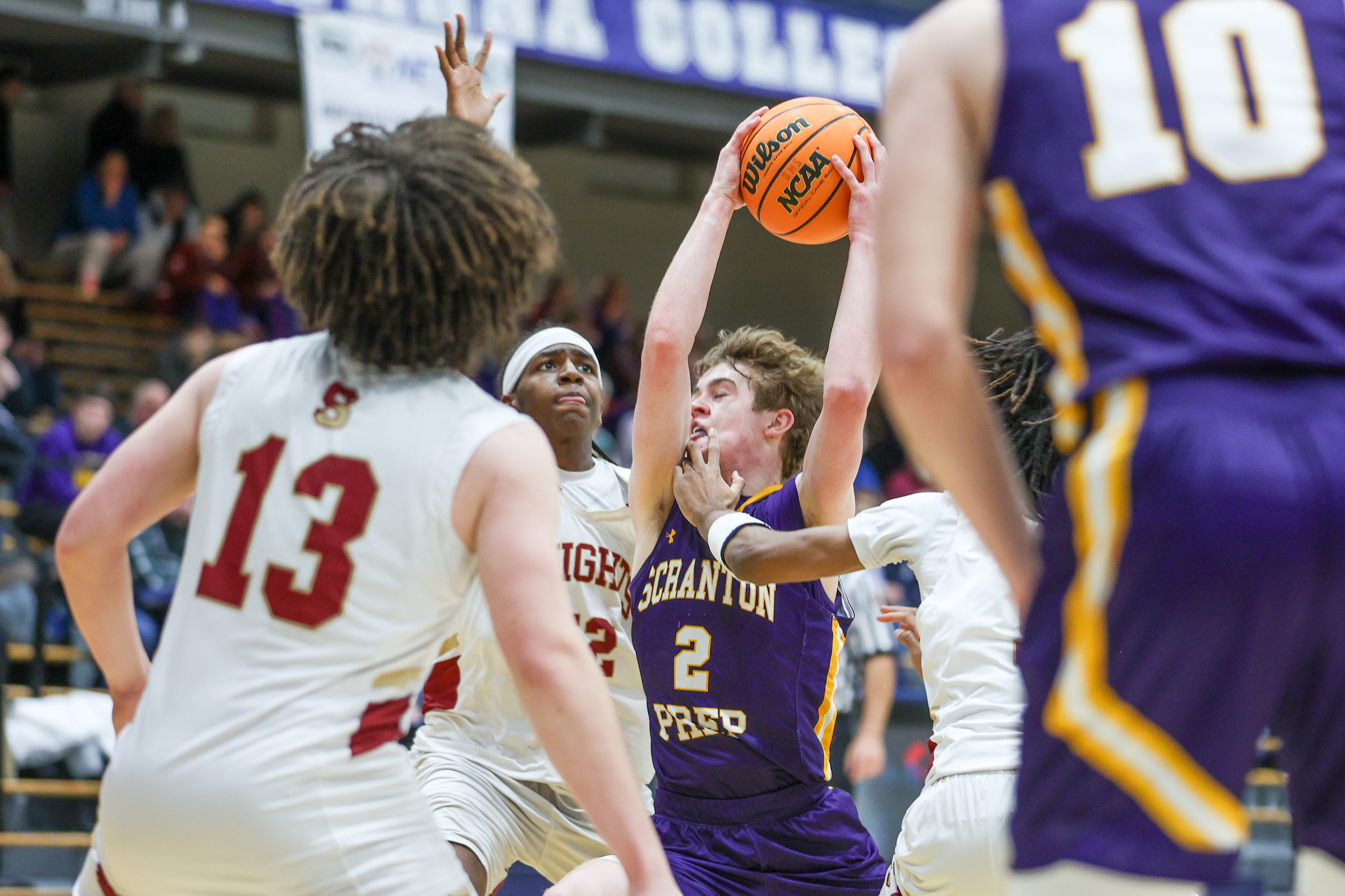 Scranton Prep’s Brody Martin (2) drives through defenders during the...