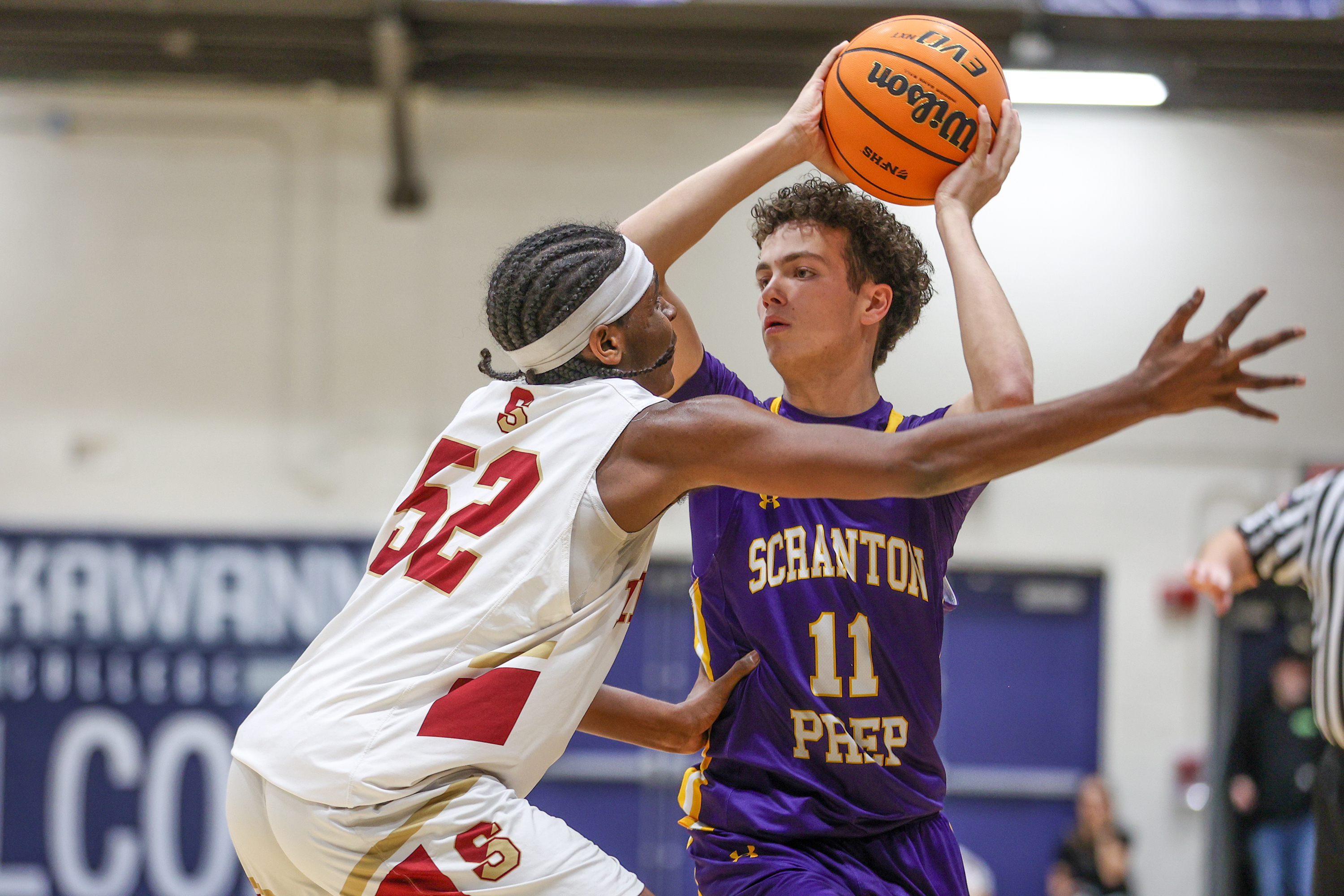 Scranton Prep’s Jack Pavuk (20) looks for a way around...