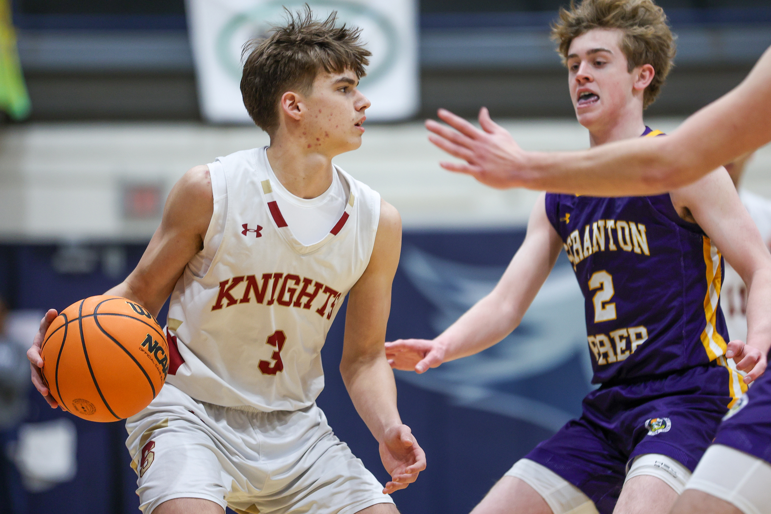Scranton’s Max DePietro (3) looks for a way pasy Scranton...