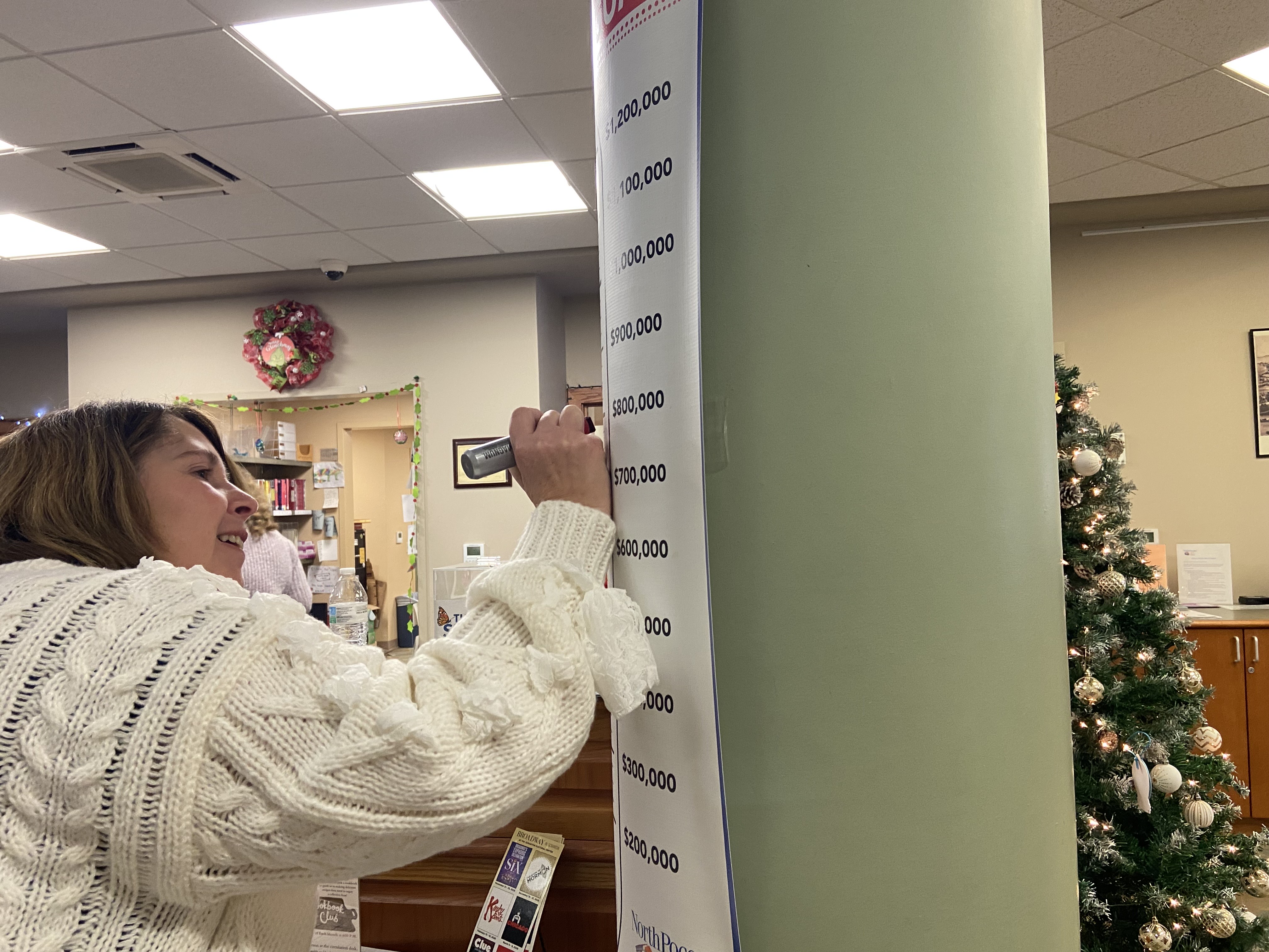 North Pocono Public Library Director Joy Monroe updates the amount...