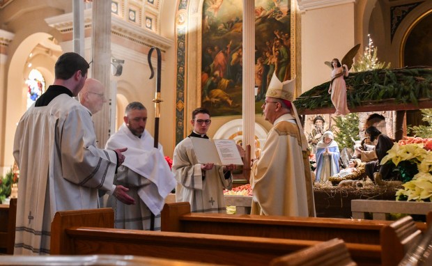 Bishop Joseph Bambera, right, leads the Christmas Eve Pontifical Mass on at St. Peter's Cathedral in Scranton Wednesday, December 24, 2025. (SEAN MCKEAG / STAFF PHOTOGRAPHER)