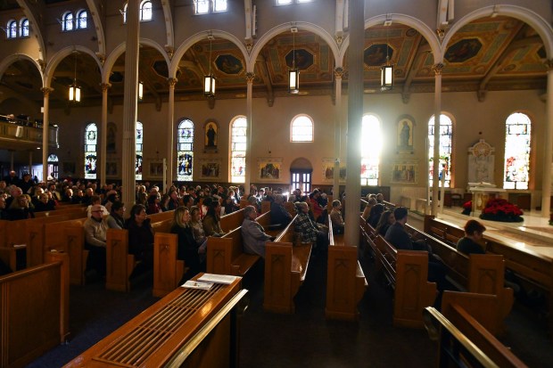 The evening sun shines through the windows of St. Peter's Cathedral in Scranton during the Christmas Eve Pontifical Mass Wednesday, December 24, 2025. (SEAN MCKEAG / STAFF PHOTOGRAPHER)