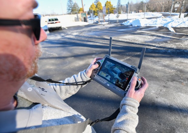 Johnny Lubeck, owner of NEPA Drone, controls his DJI Matrice drone in the Blakely Borough Recreational Complex in Peckville Thursday, December 18, 2025. (SEAN MCKEAG / STAFF PHOTOGRAPHER)