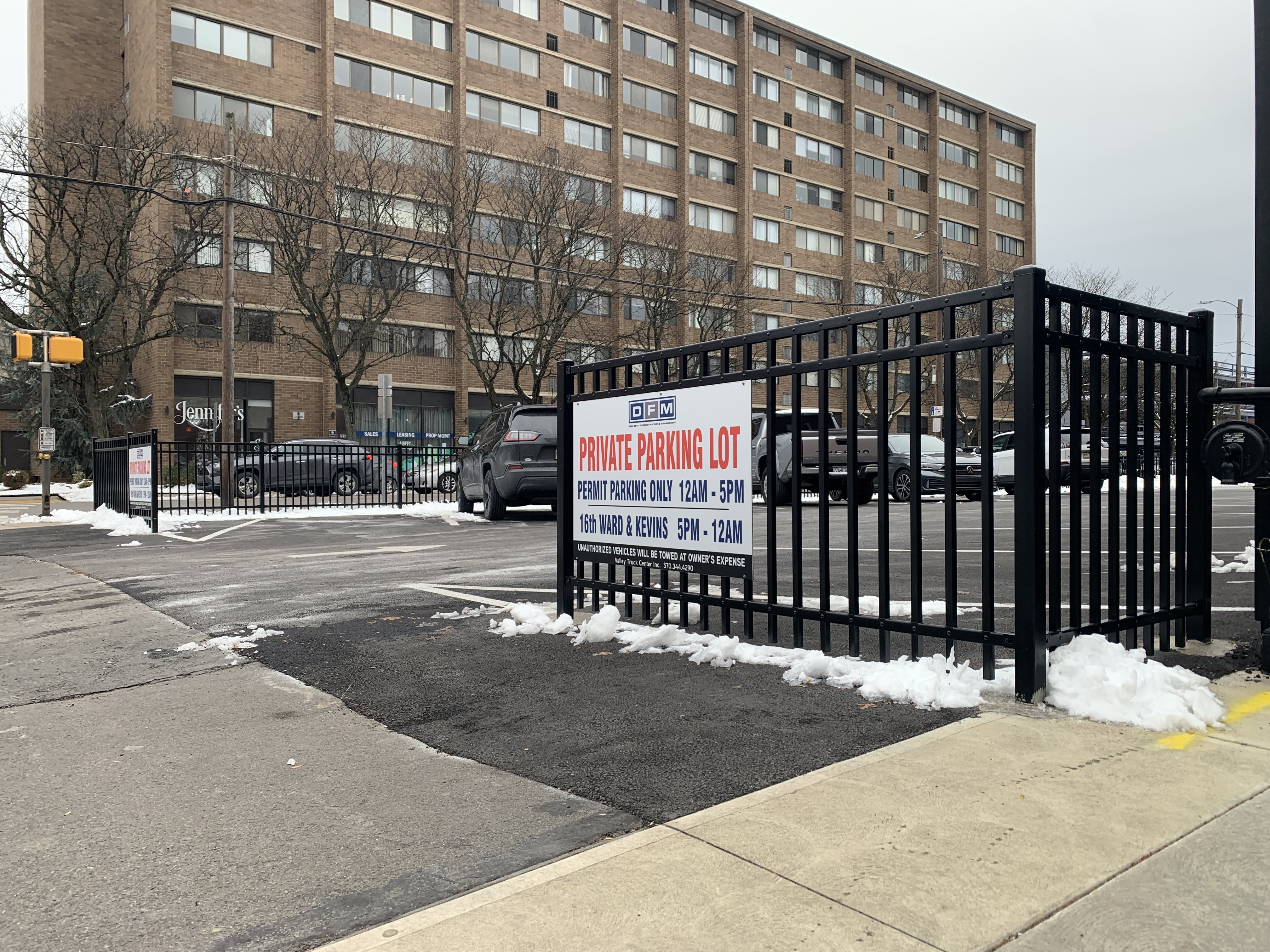 A parking lot and fence owned by Don Mammano at...