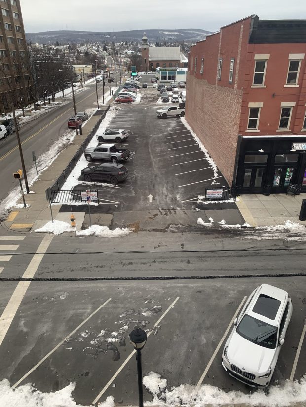A parking lot and fence owned by Don Mammano at 301-303 Penn Ave. in Scranton on Friday, Dec. 5, 2025. (JIM LOCKWOOD / STAFF PHOTO)