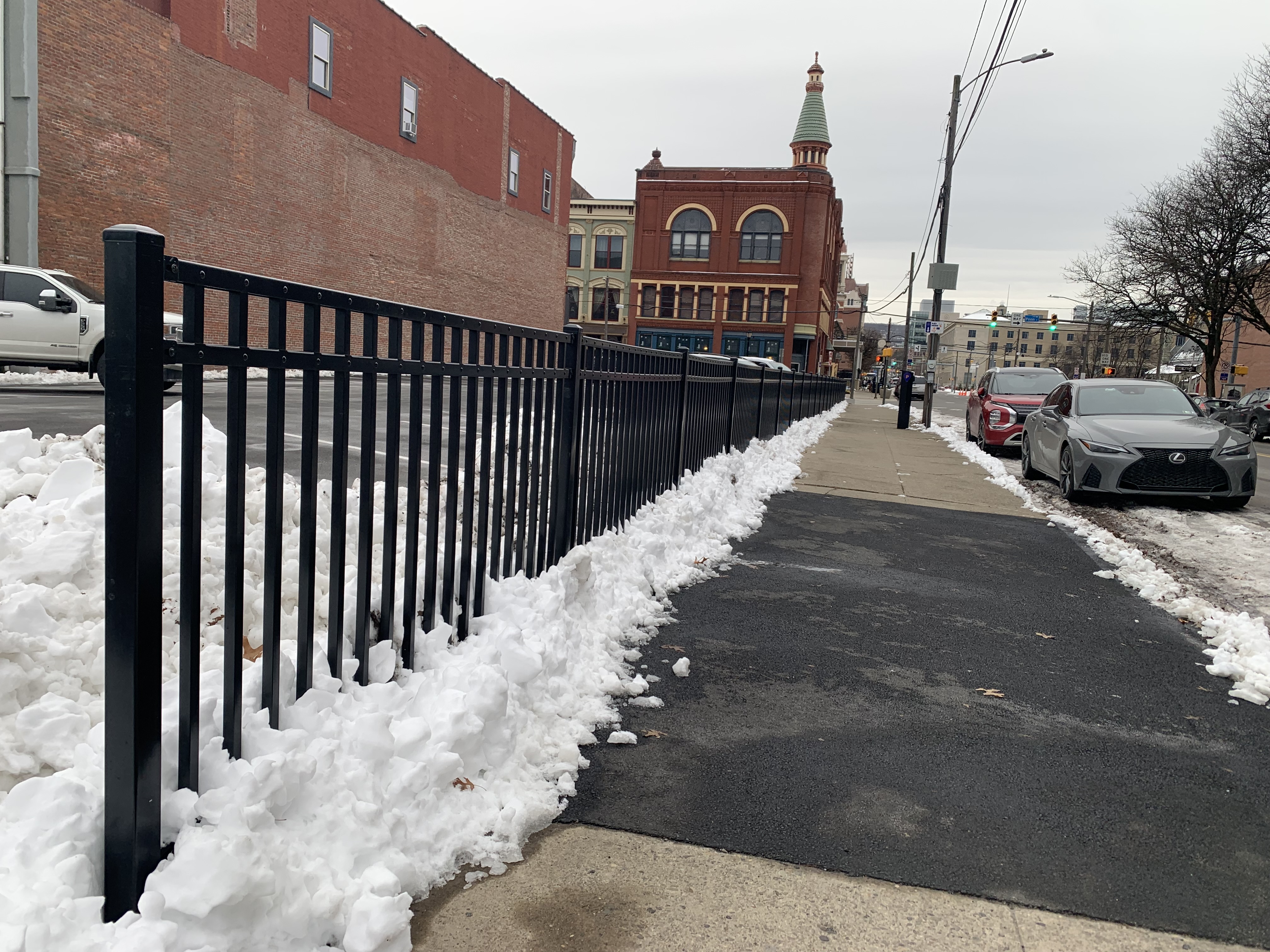 A parking lot and fence owned by Don Mammano at...