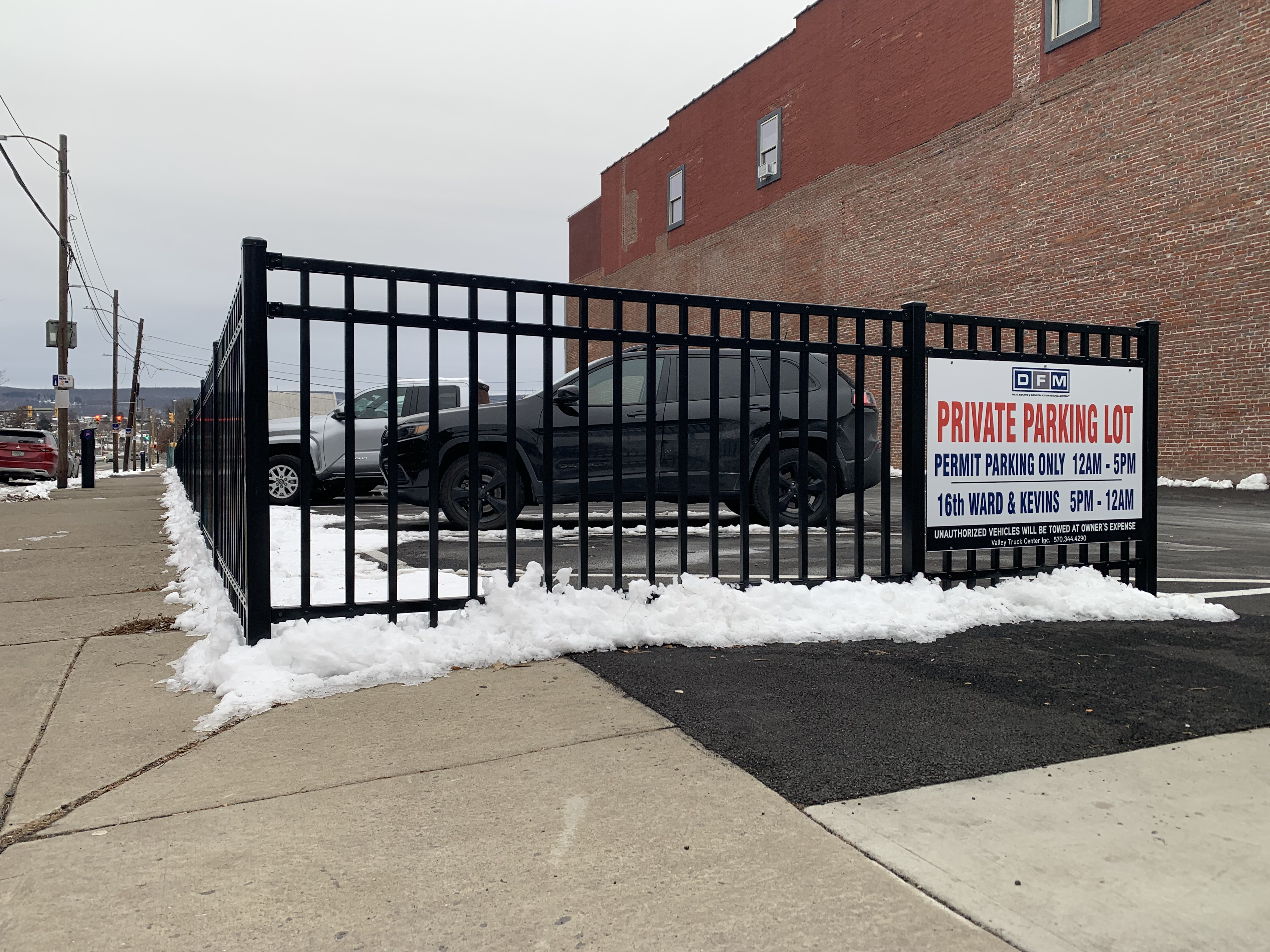 A parking lot and fence owned by Don Mammano at...