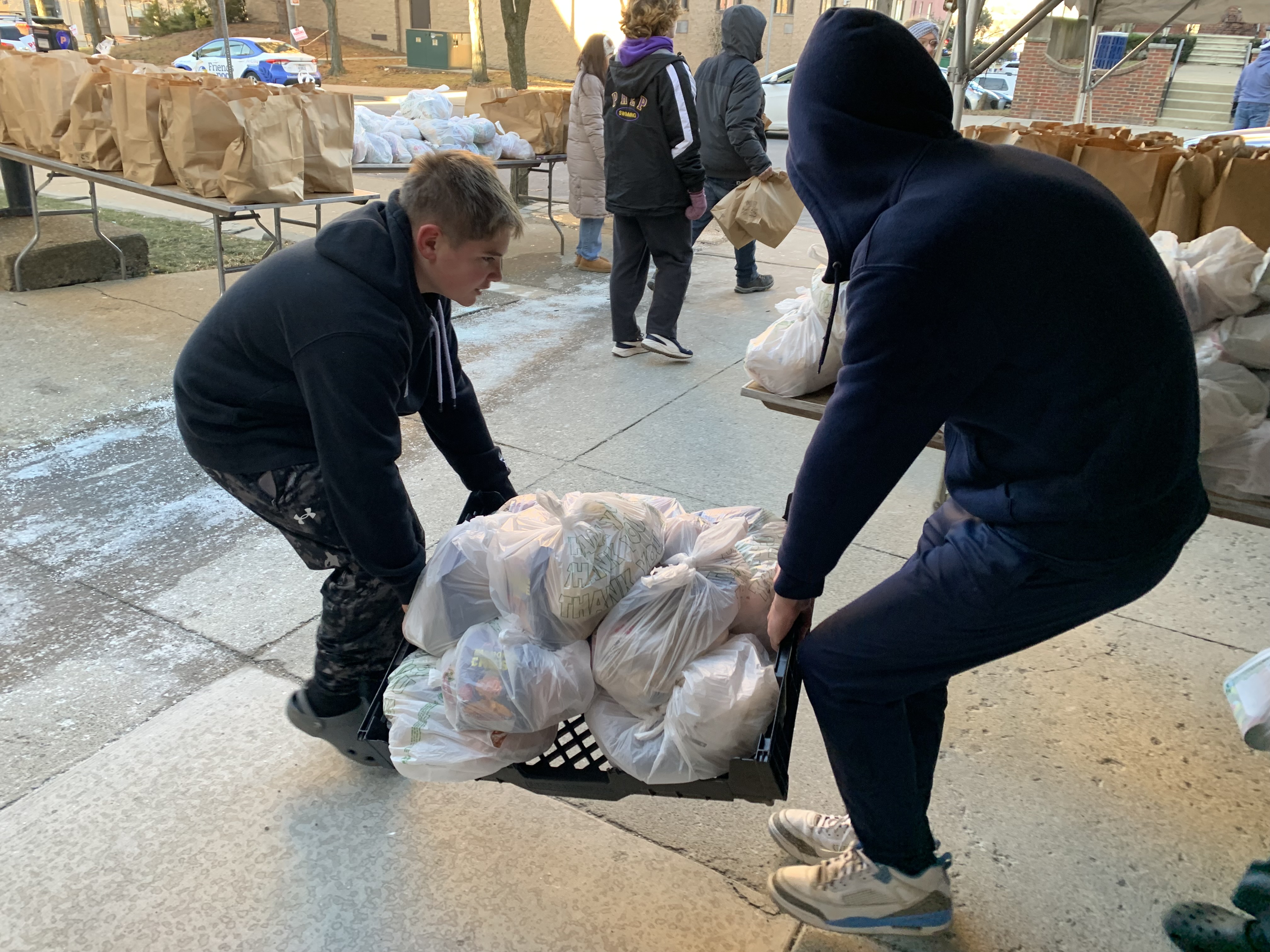 Ethan Salerno, at left, and Alex Schlegel, both 14, carry...