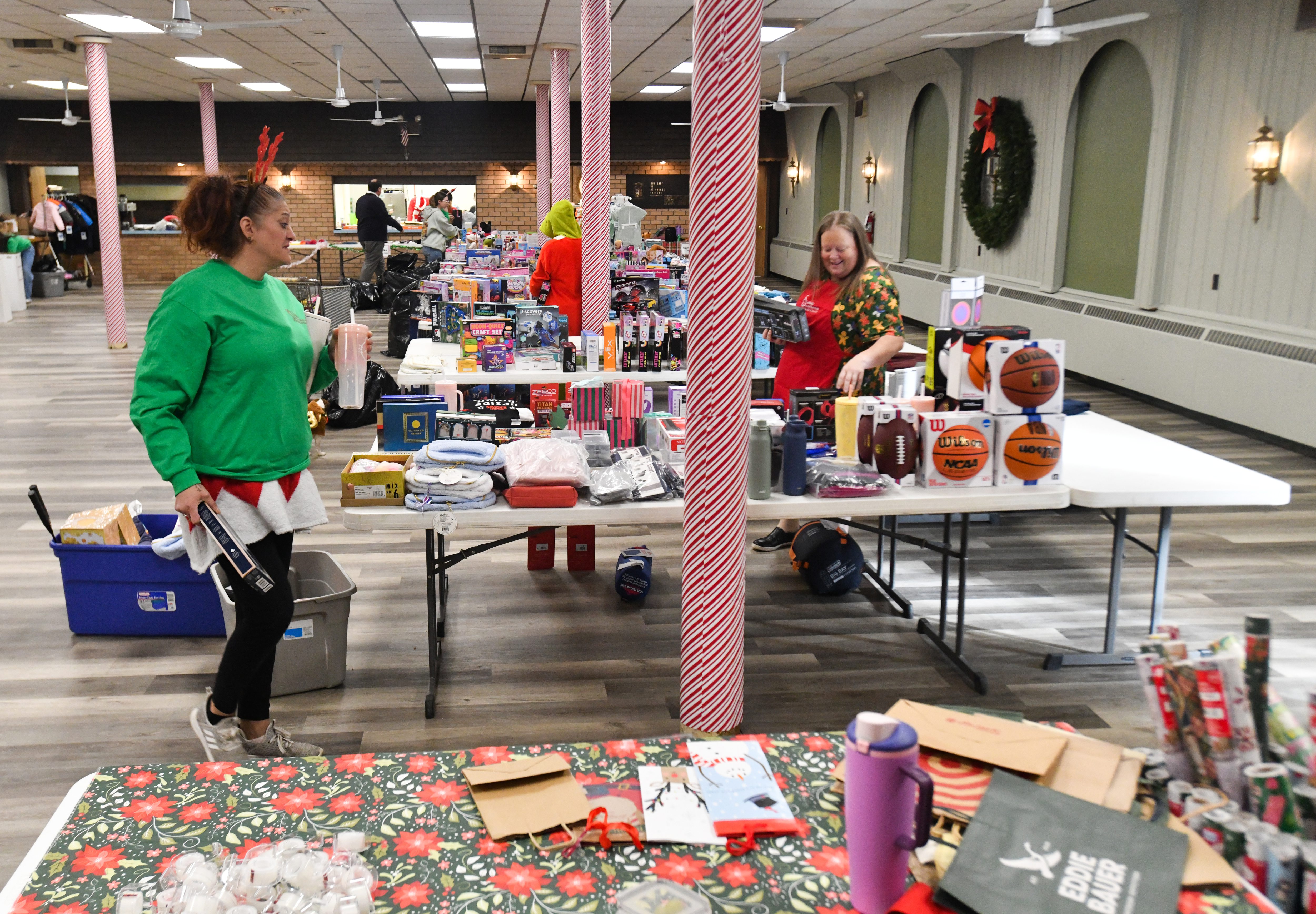 Catholic Social Services volunteer Christina Hoffman and April Bezdziecki, supervisor...
