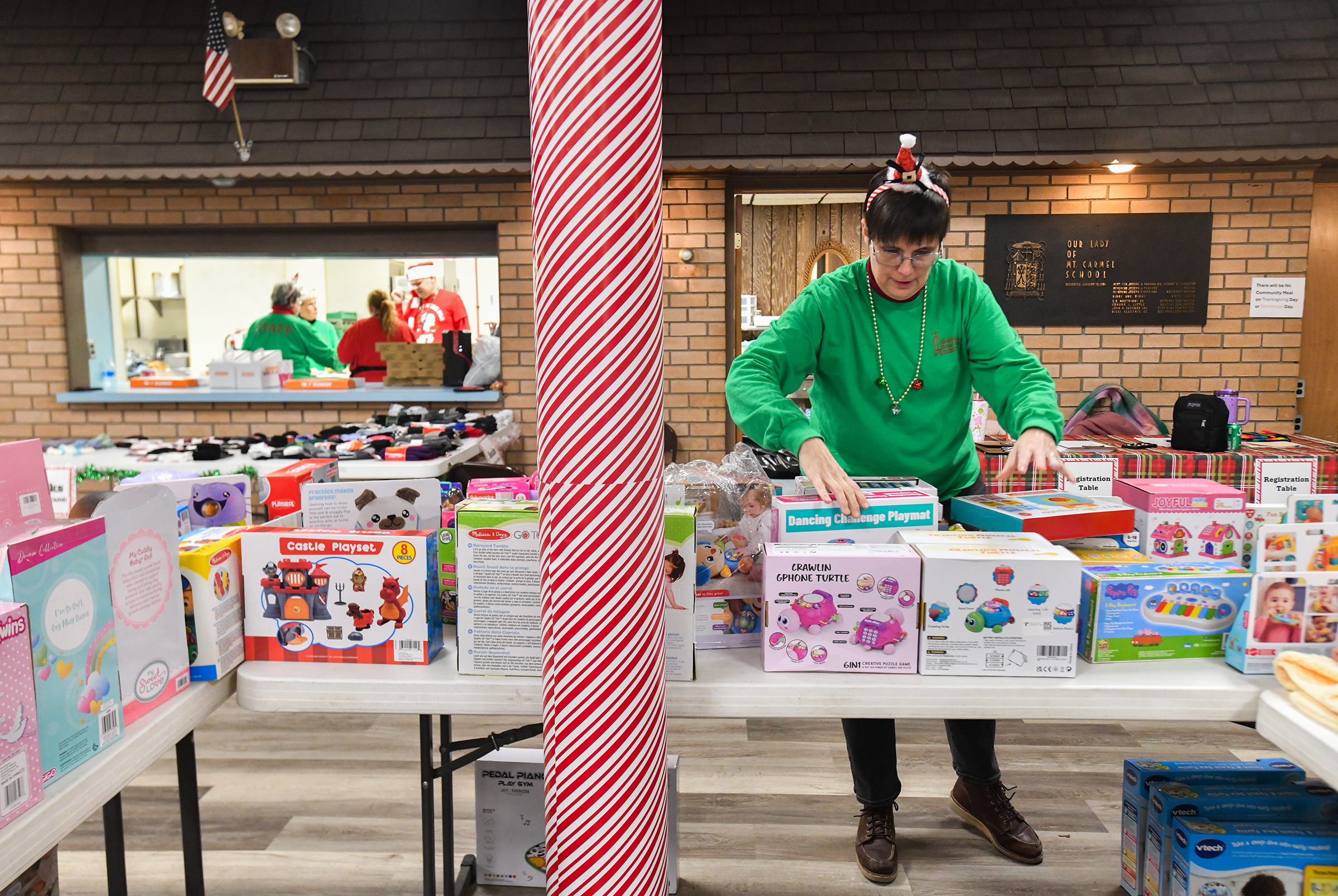 Dorothy O’Connor, adminstrative assistant for Catholic Social Services, puts out...