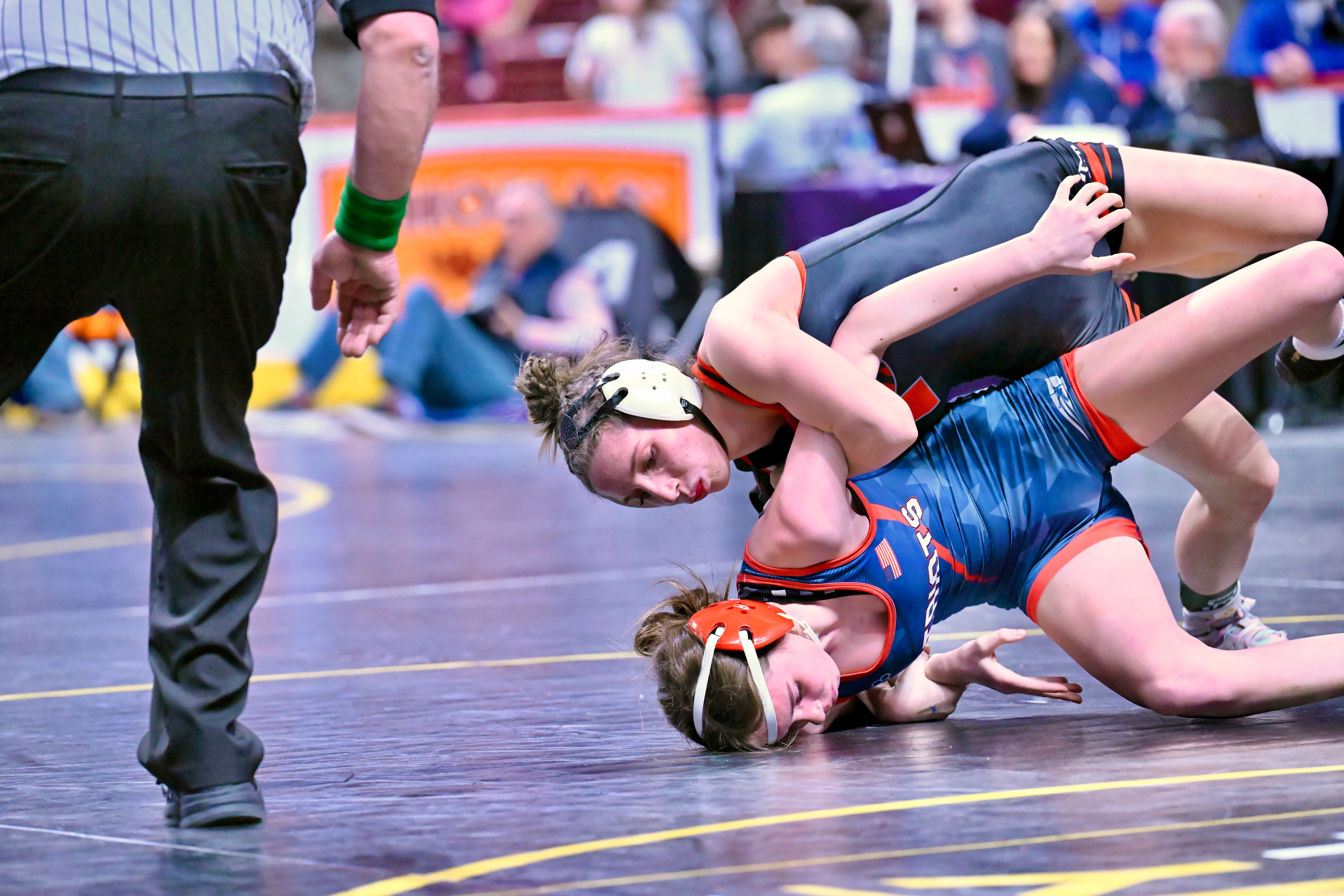 Honesdale’s Saige Olver, top, wrestles Red Land’s Ava Holjes in...