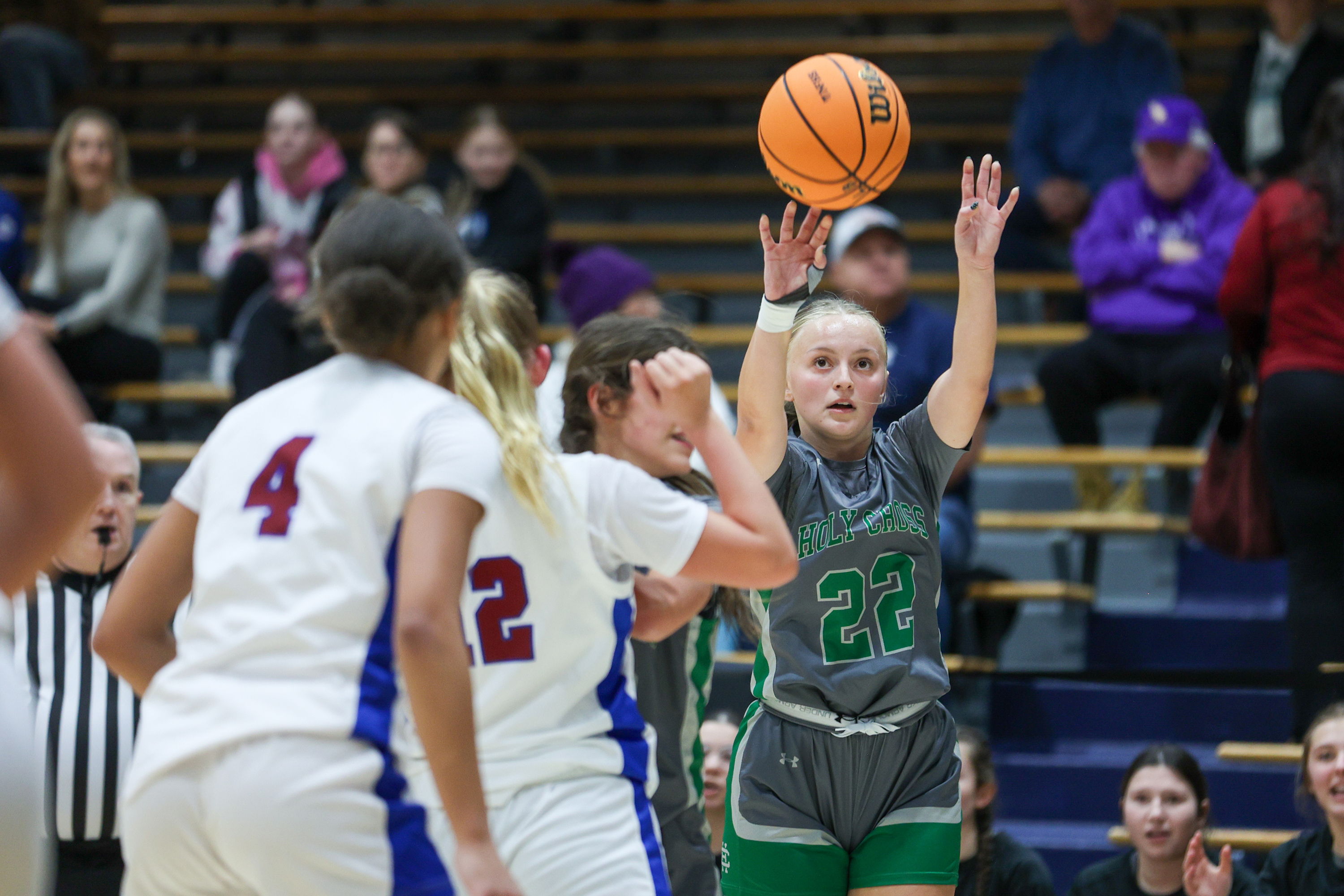 Holy Cross’ Lila Kolcharno (22) takes a three-point shot during...
