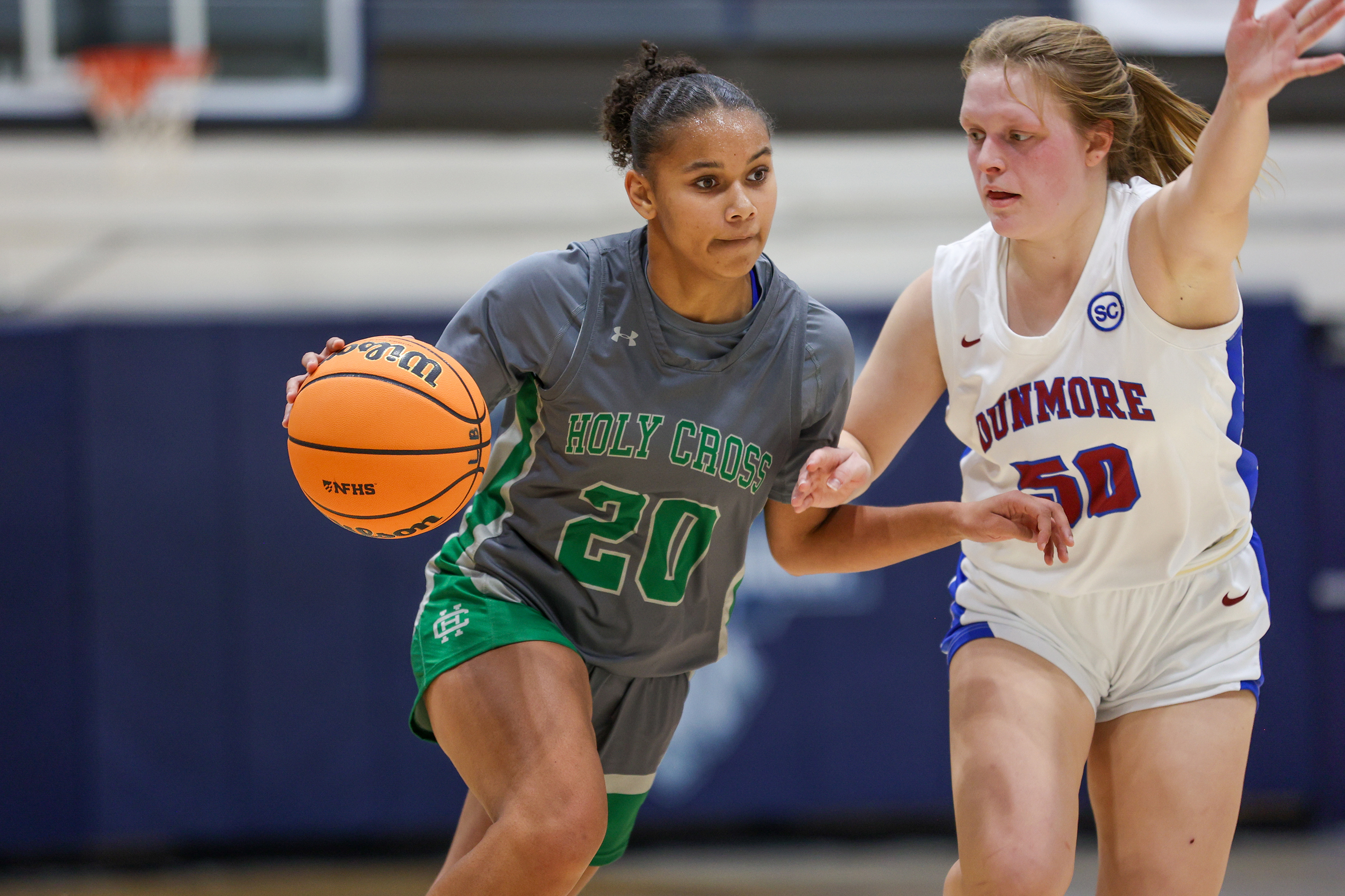 Holy Cross’ Malice Blackwell (20) drives toward the basket during...