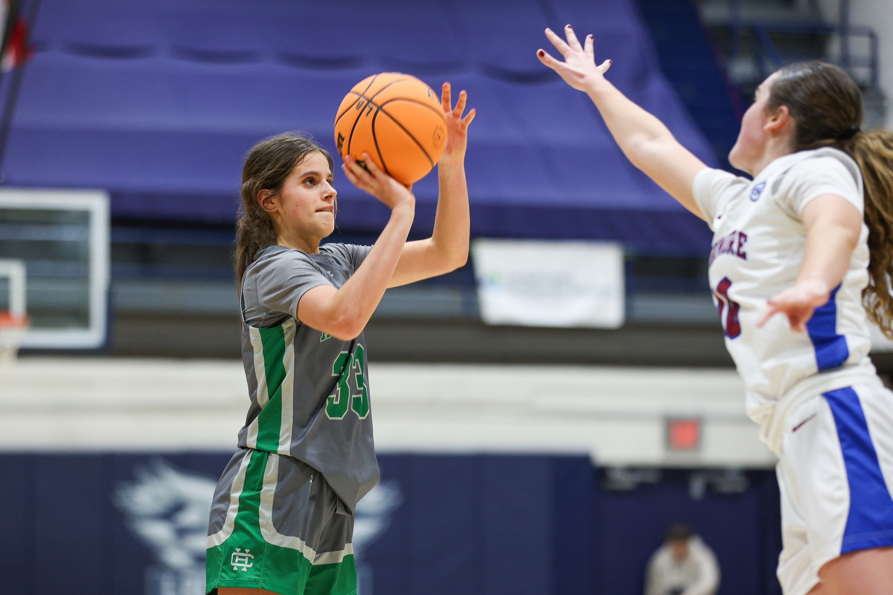 Holy Cross’ Mollie Urban (33) takes a shot during the...