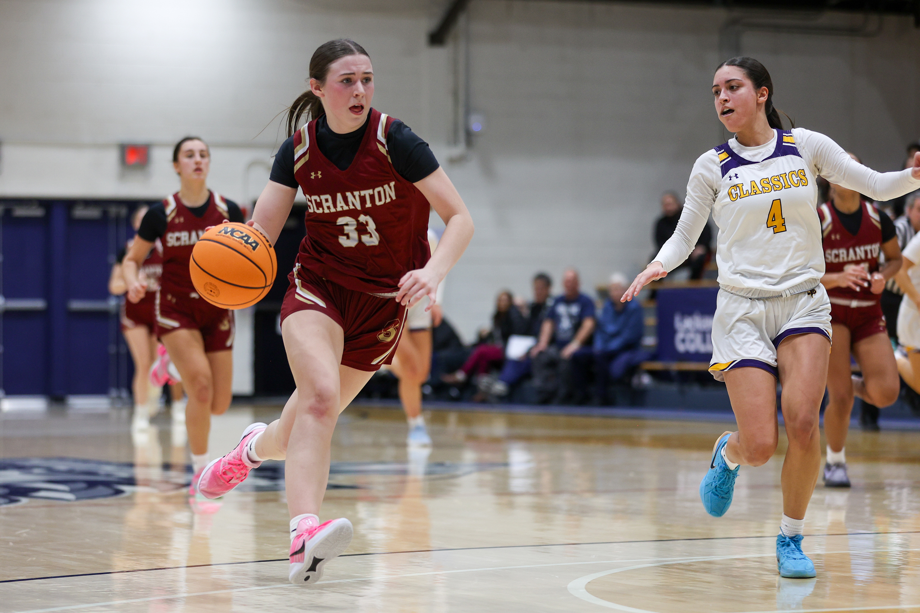 Scranton’s Rhylee Bell (33) takes the ball down the court...