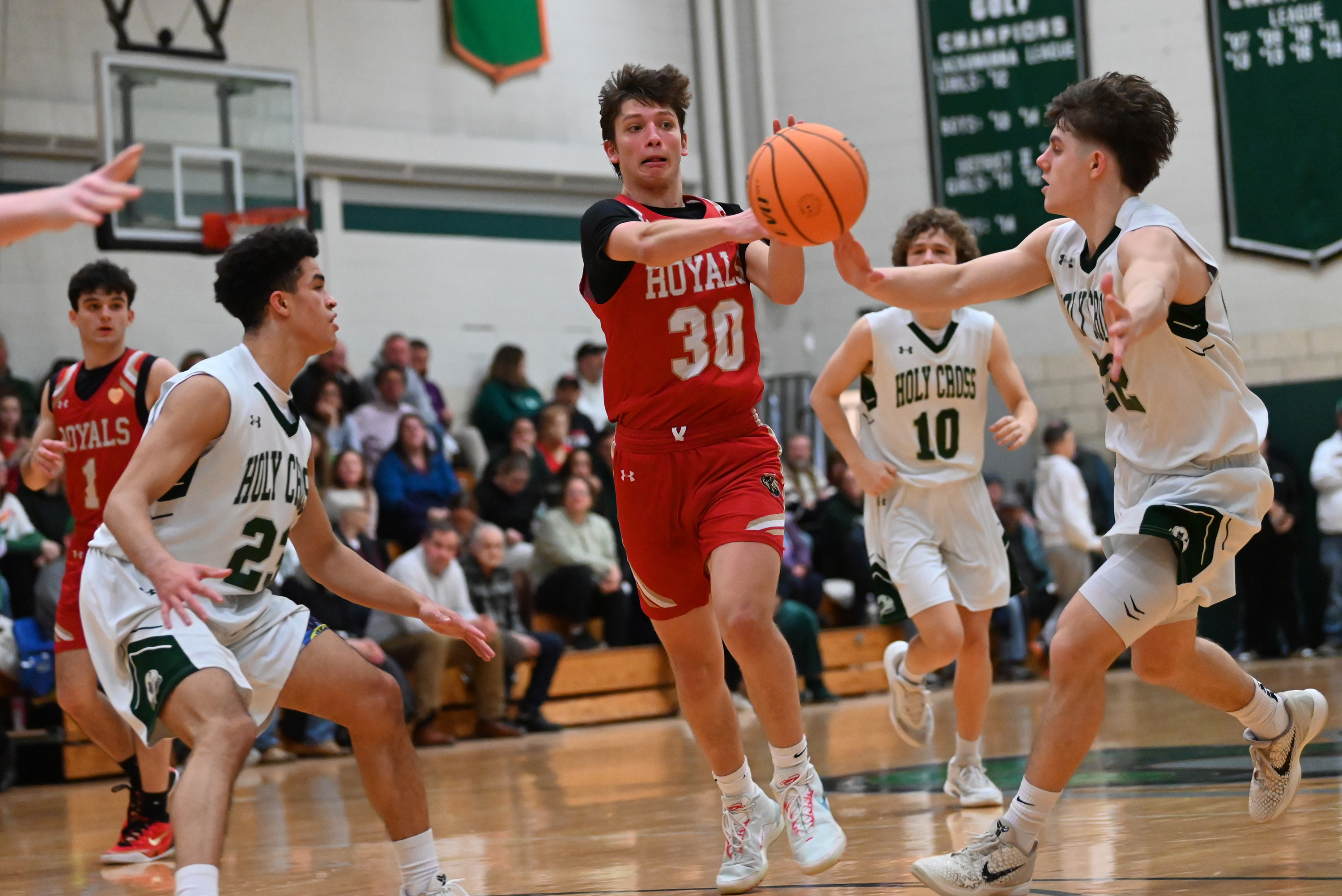 Holy Cross’ Jack Alpert deflects Holy Redeemer’s Charlie Schaffer’s pass...